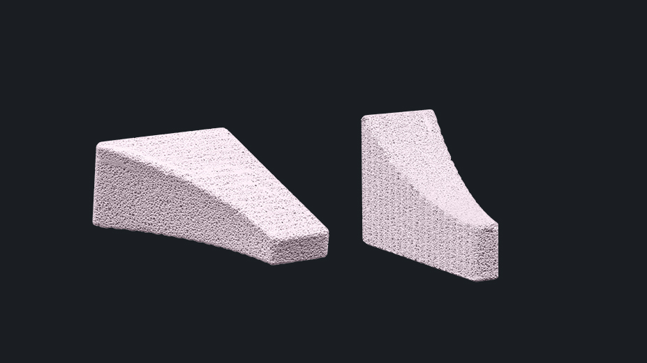 Two wedge-shaped, textured implants used in veterinary orthopedics for corrective osteotomies, designed to support precise bone alignment procedures